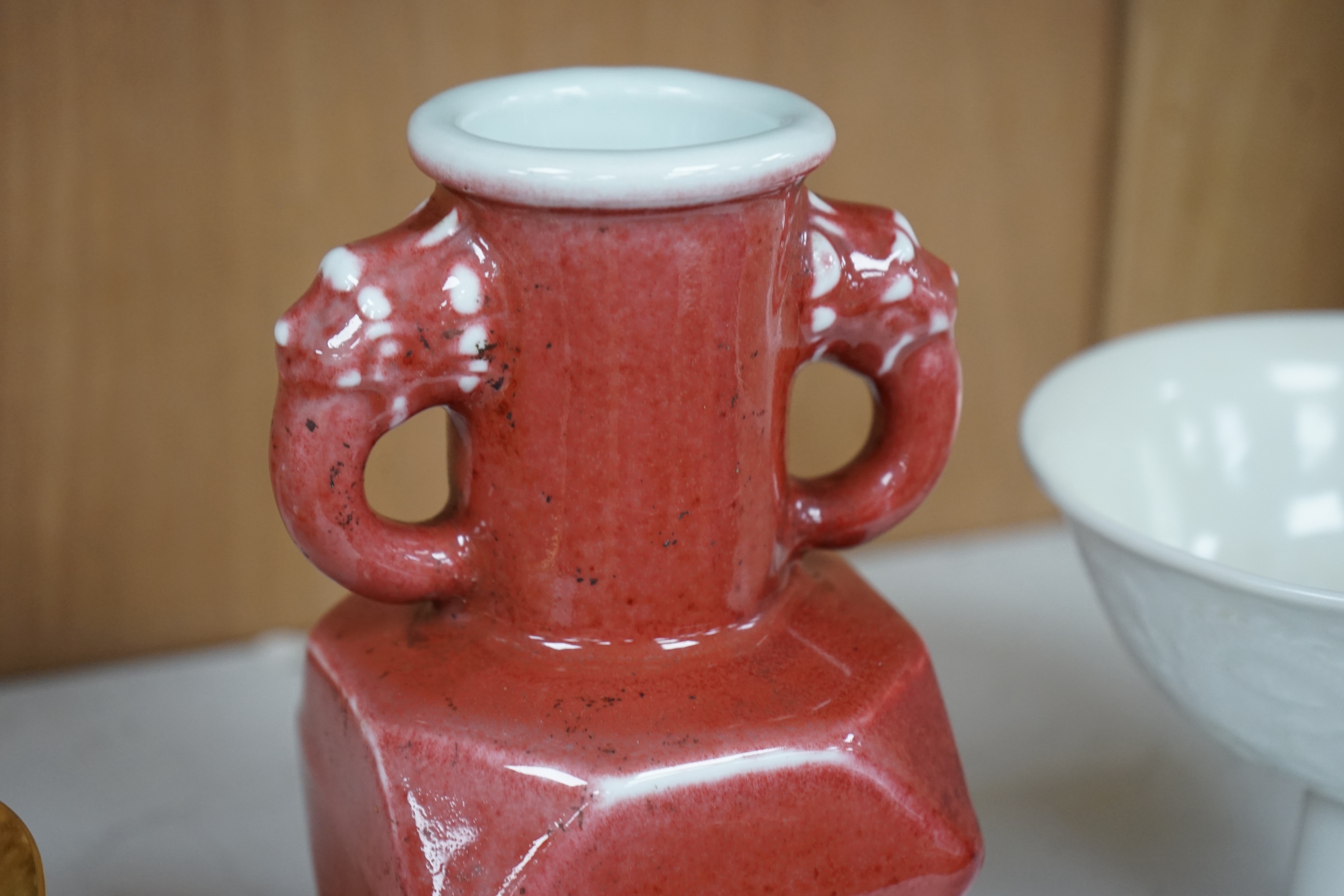 A Chinese red glazed elephant handled vase and a white glazed 'dragon' stem dish, tallest 18cm high. Condition - good